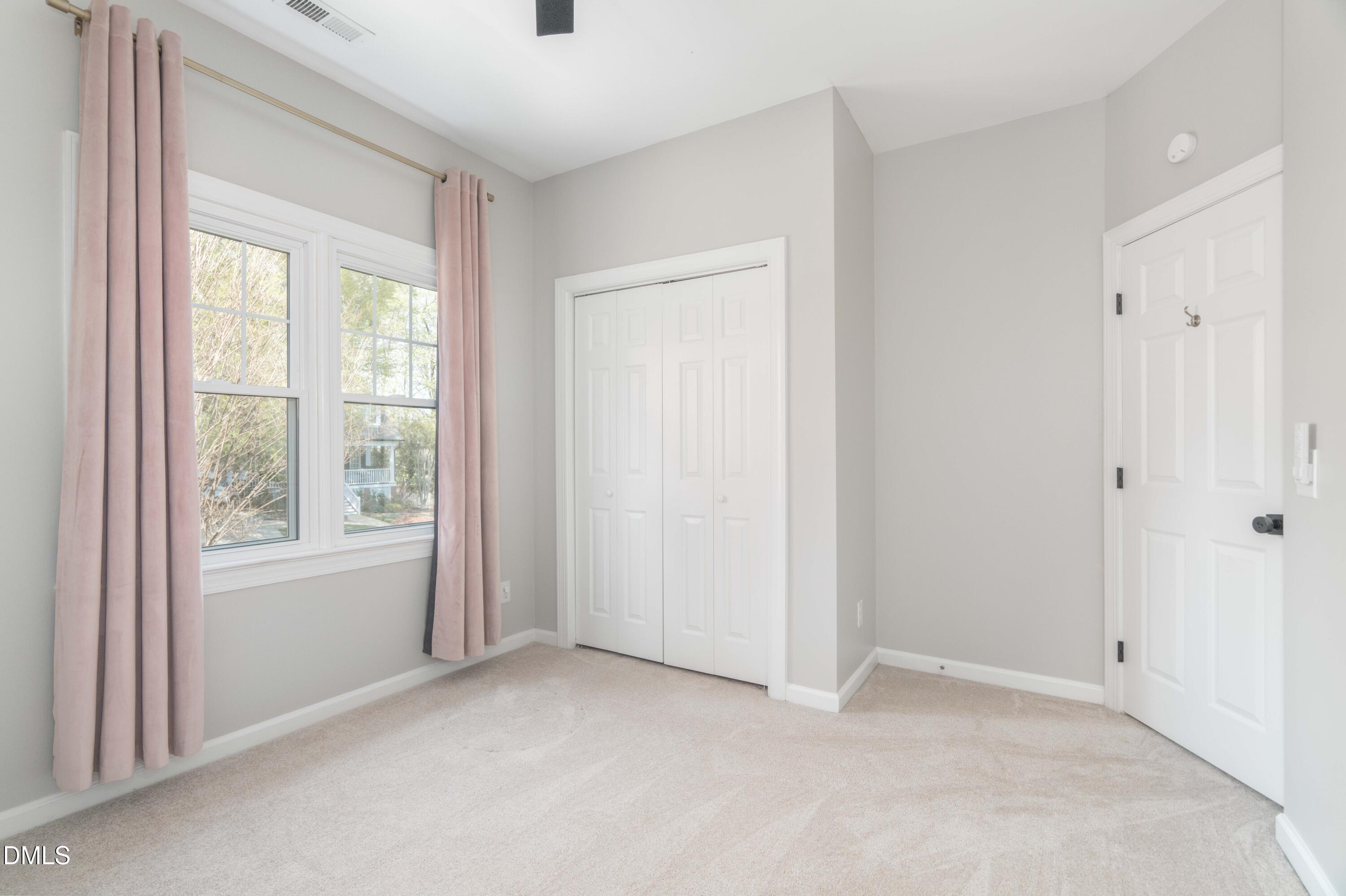 1512 Cooper Falls Lane Raleigh, NC 27614 - Photo 44 of 64 an empty room with windows
