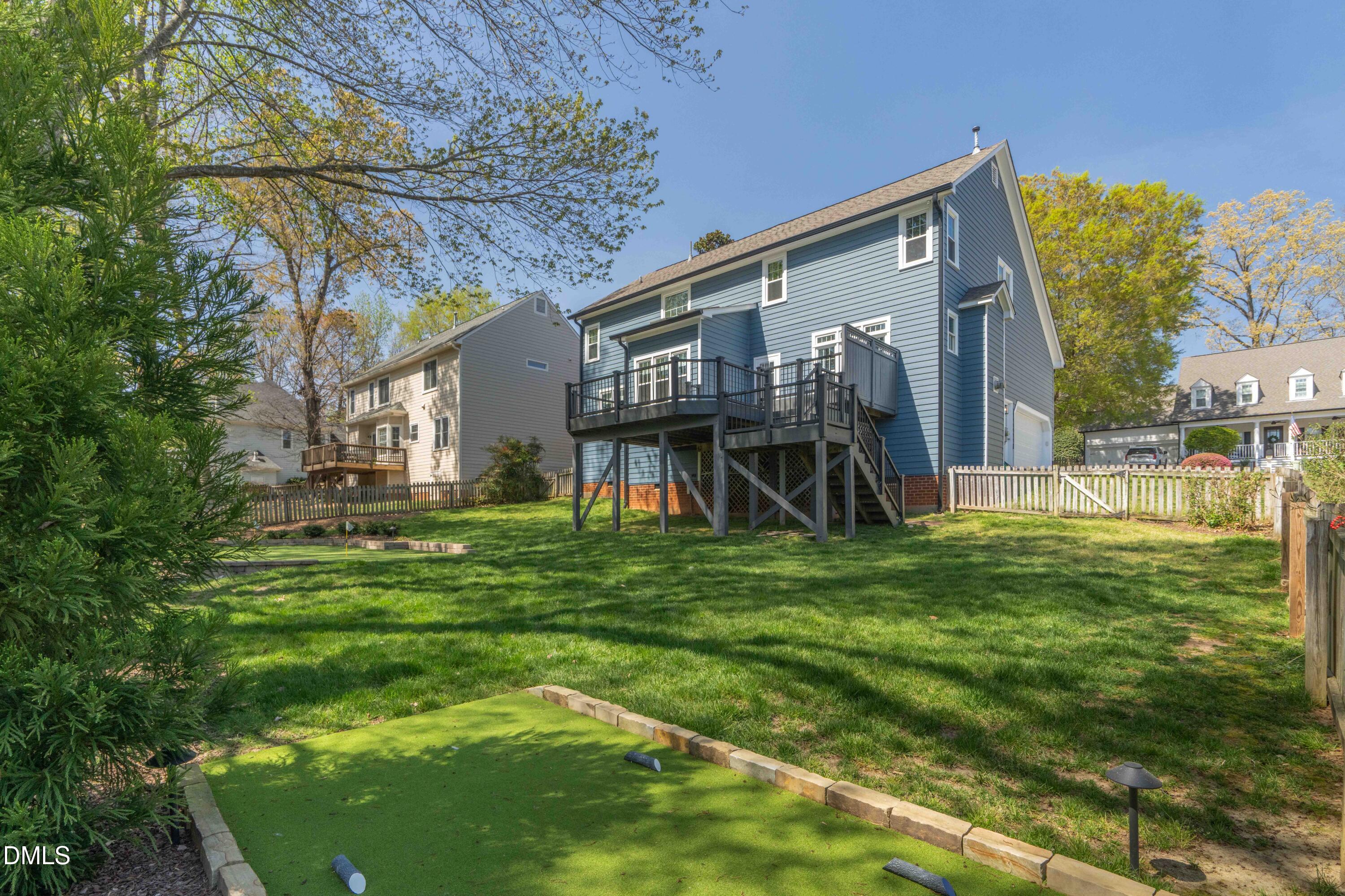 1512 Cooper Falls Lane Raleigh, NC 27614 - Photo 56 of 64 a view of a backyard with a garden and plants