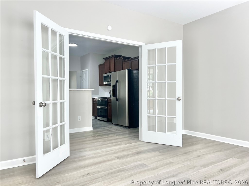 1523 Rough Rider Lane Parkton, NC 28371 - Photo 21 of 42 a view of a kitchen with wooden floor and a kitchen