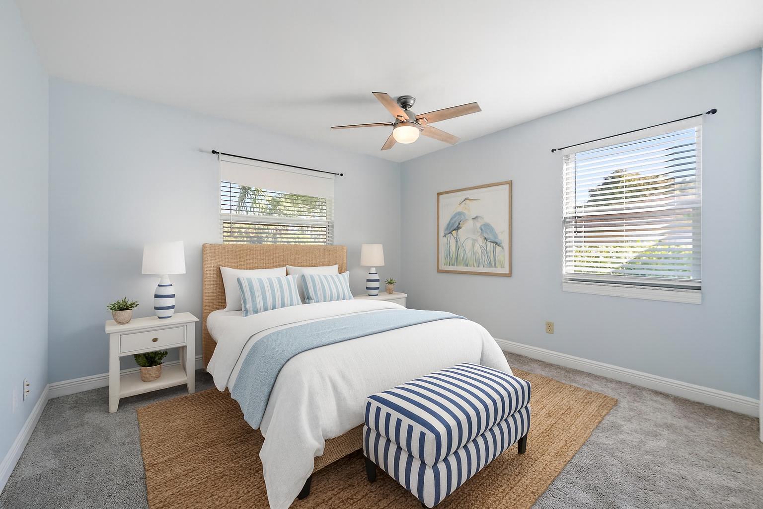 1260 Southwest 25th Lane Palm City, FL 34990 - Photo 21 of 37 a bedroom with a white bed and a window