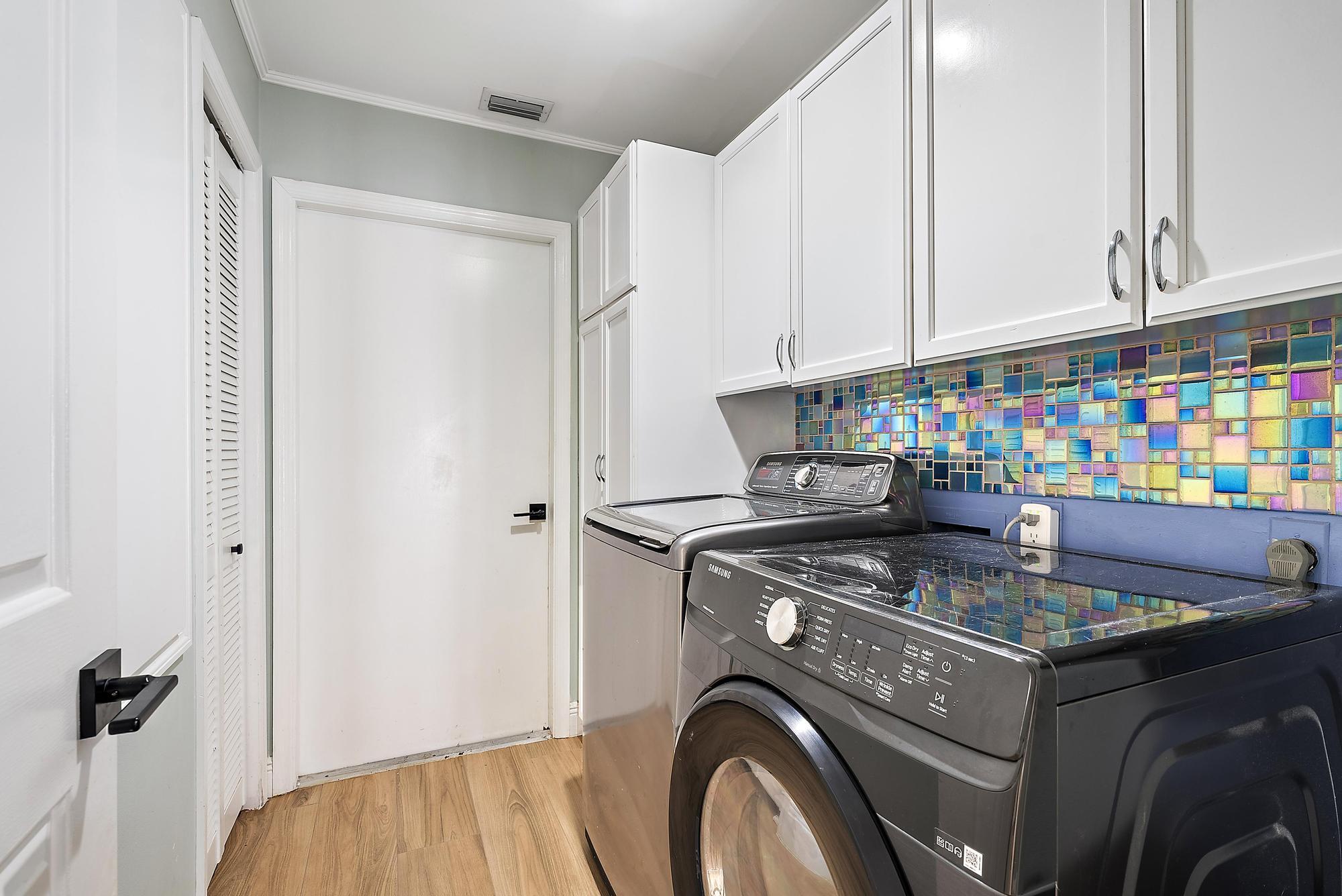1260 Southwest 25th Lane Palm City, FL 34990 - Photo 24 of 37 a utility room with dryer and washer