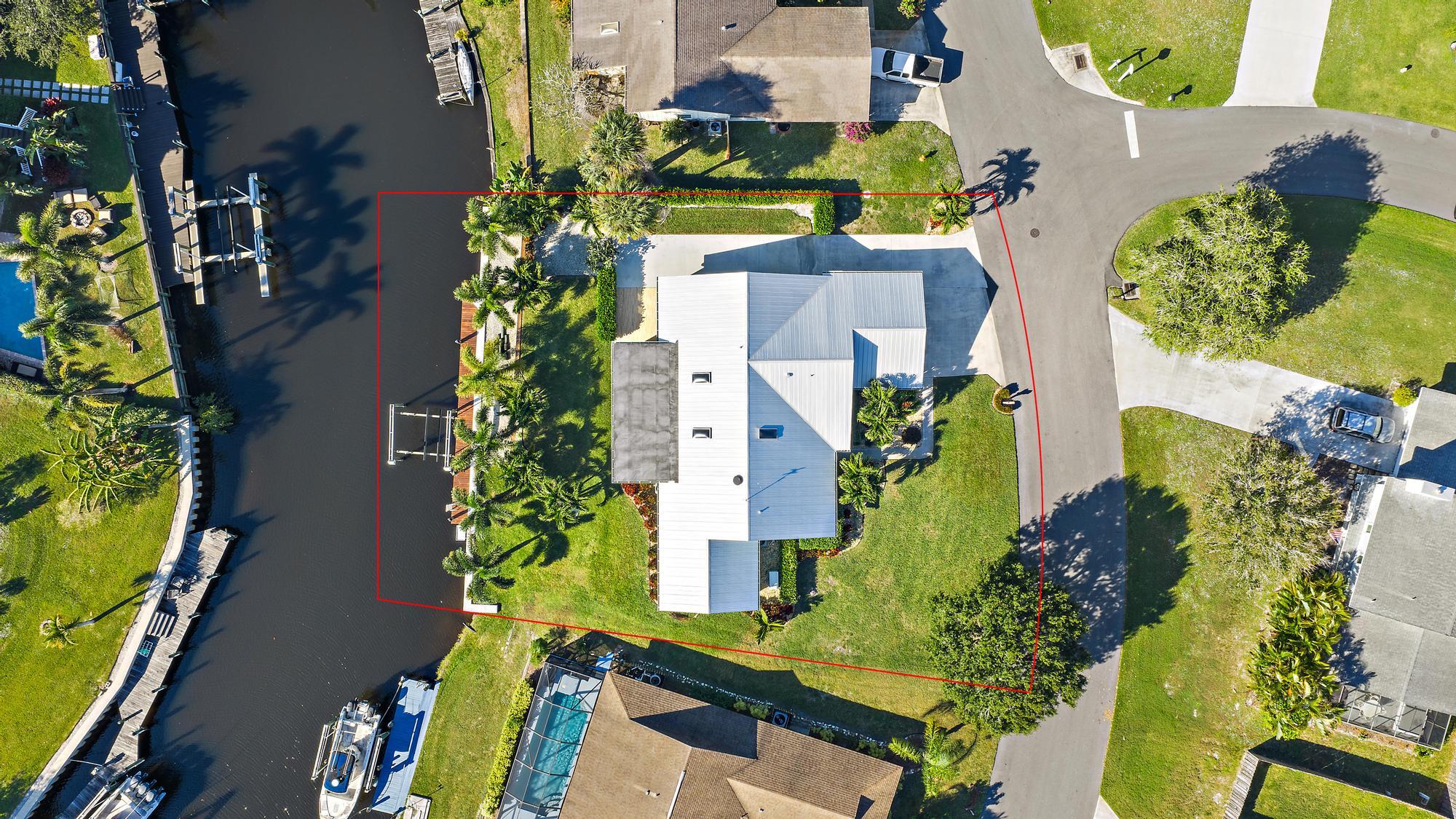 1260 Southwest 25th Lane Palm City, FL 34990 - Photo 32 of 37 an aerial view of a residential houses with yard