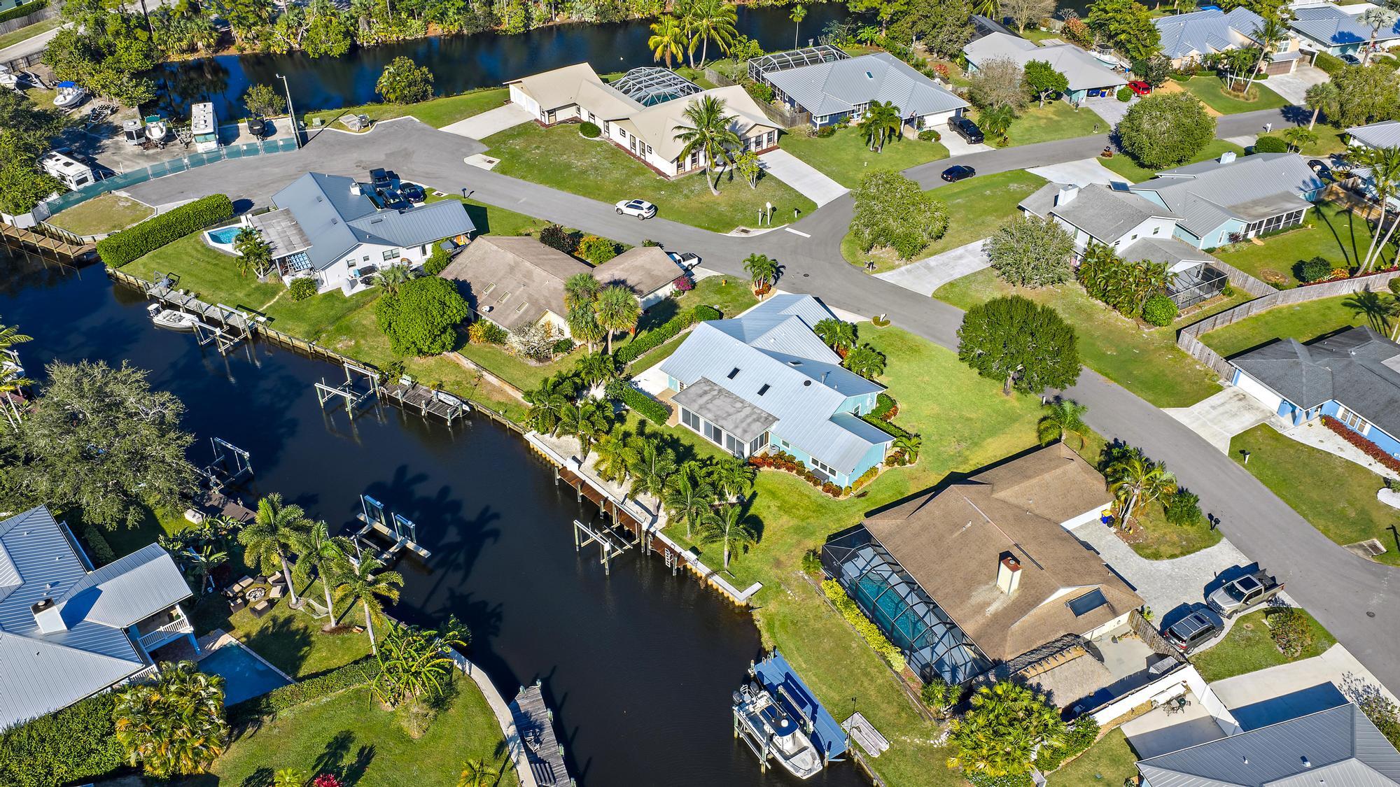 1260 Southwest 25th Lane Palm City, FL 34990 - Photo 35 of 37 an aerial view of a residential houses with outdoor space