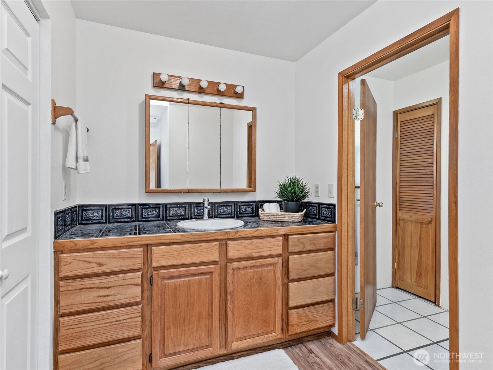 919 43rd Street Port Townsend, WA 98368 - Photo 13 of 28 a bathroom with a sink and a mirror