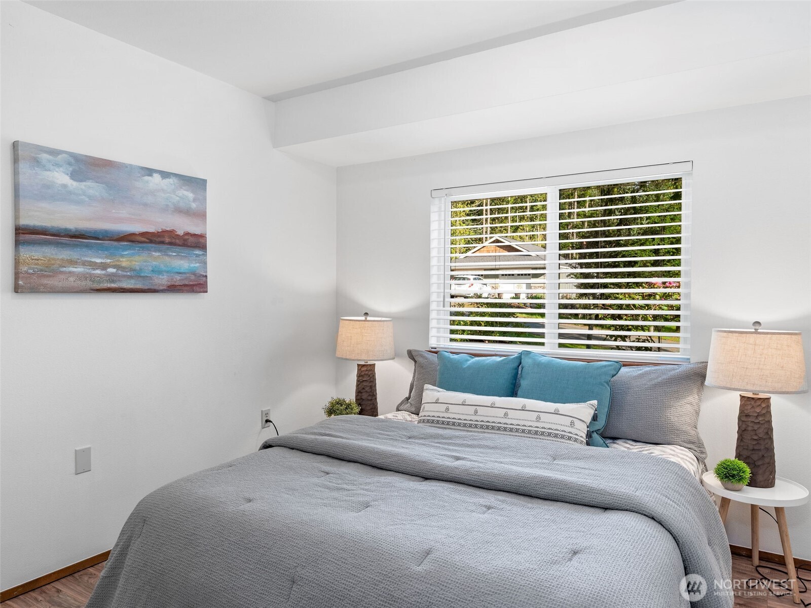 919 43rd Street Port Townsend, WA 98368 - Photo 15 of 28 a bedroom with a bed and a lamp
