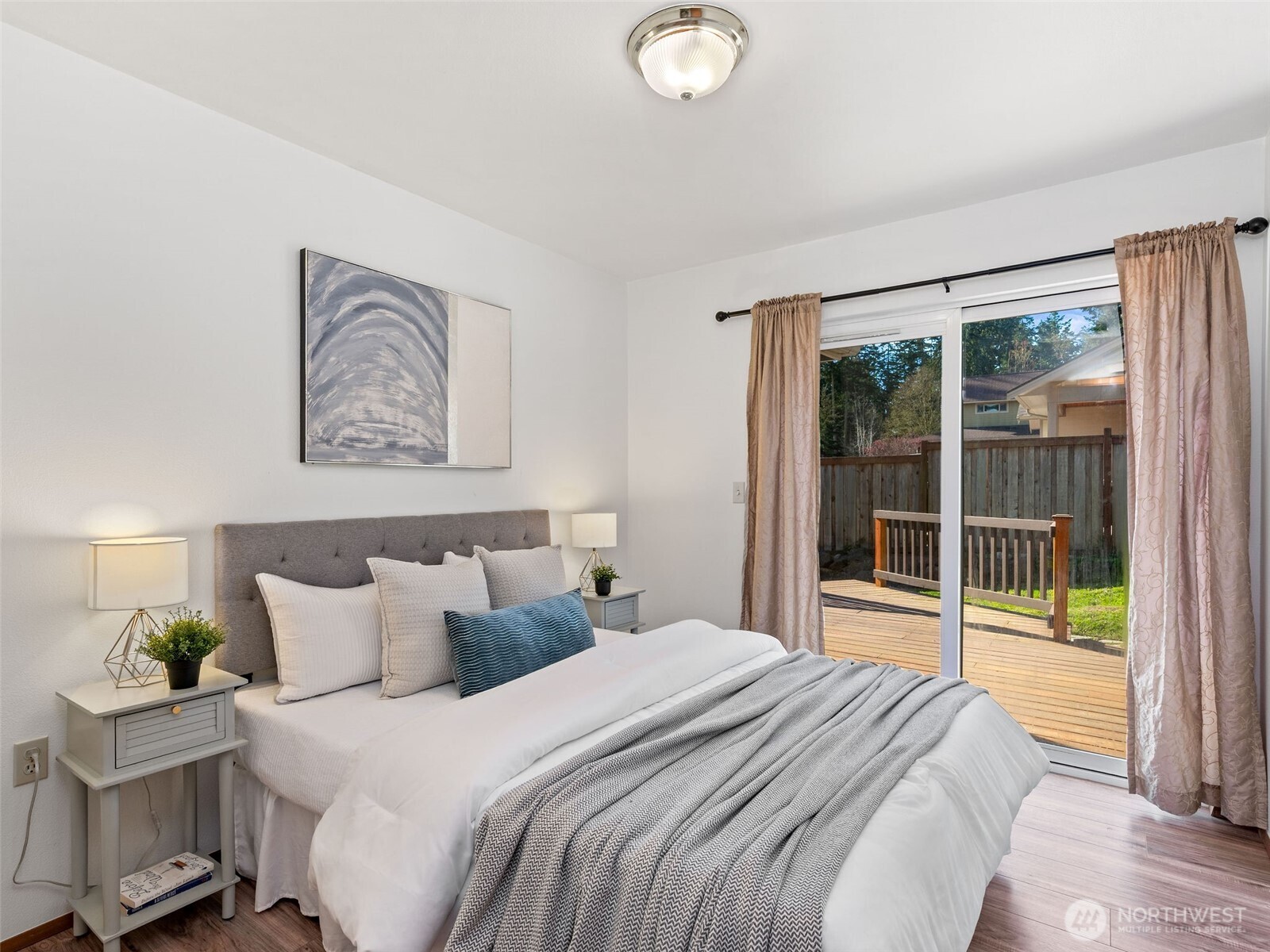 919 43rd Street Port Townsend, WA 98368 - Photo 17 of 28 a bedroom with a large bed and a large window