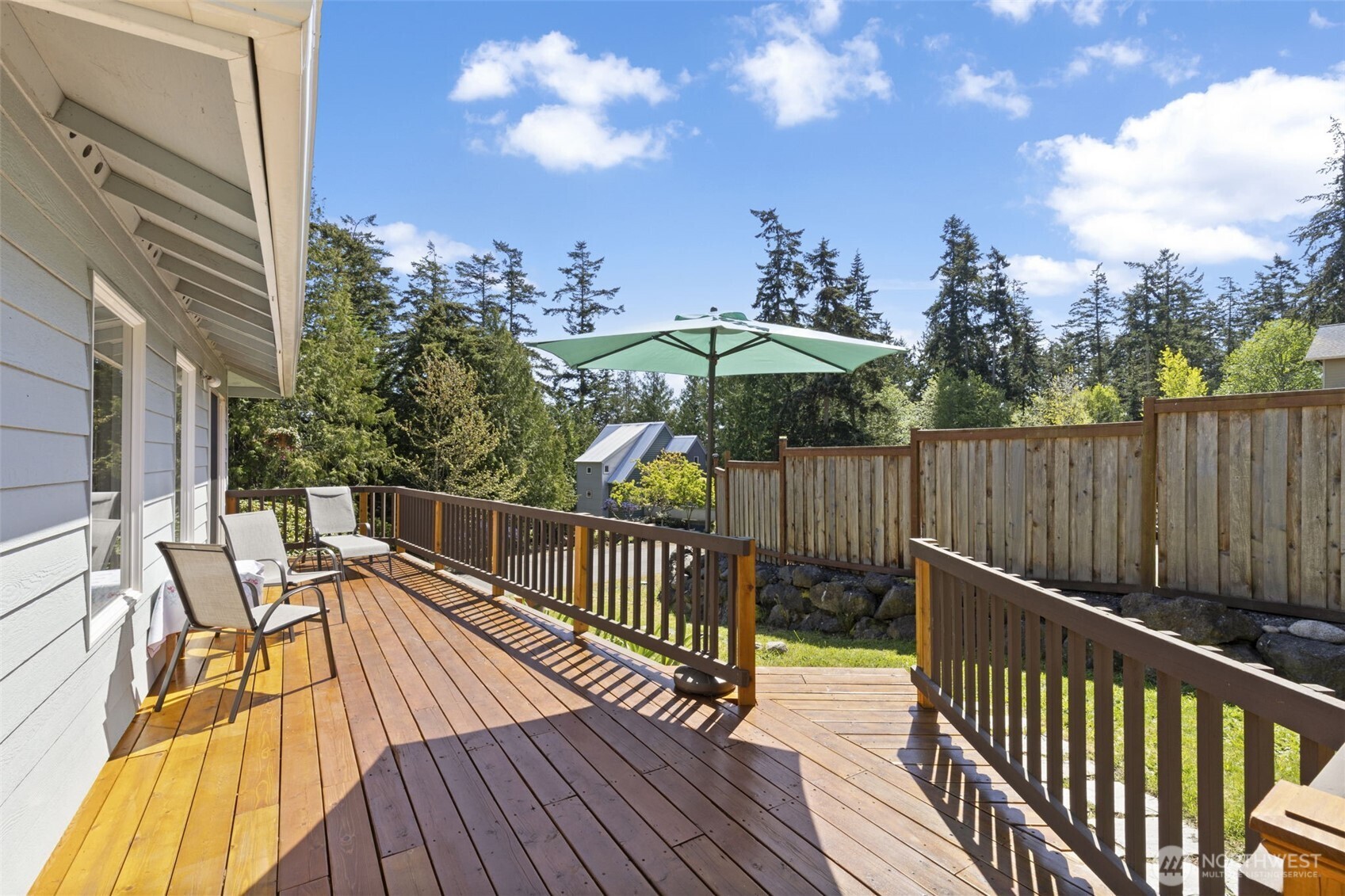 919 43rd Street Port Townsend, WA 98368 - Photo 25 of 28 a view of a balcony with wooden floor and outdoor seating