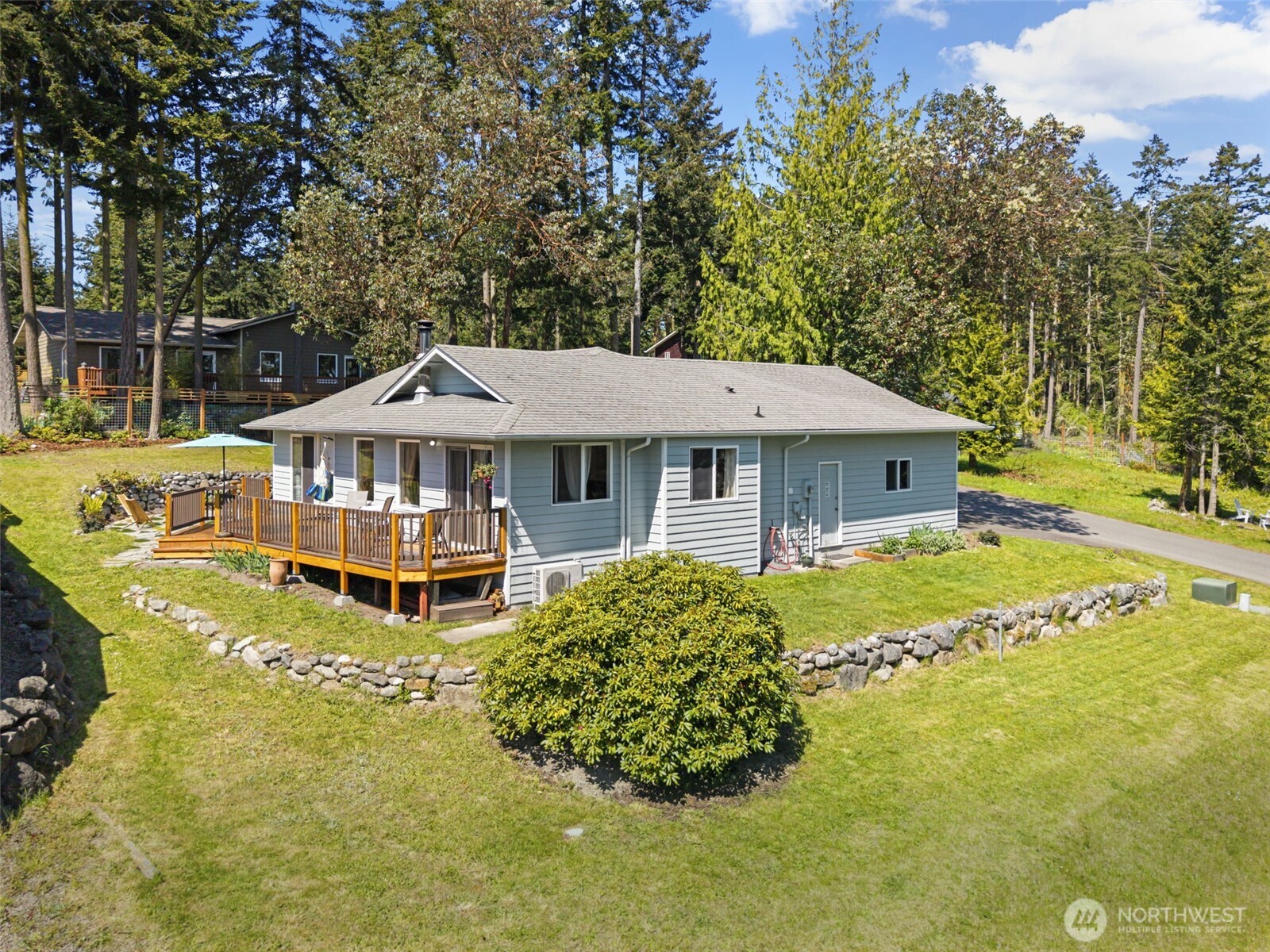919 43rd Street Port Townsend, WA 98368 - Photo 3 of 28 a front view of house with swimming pool and green space