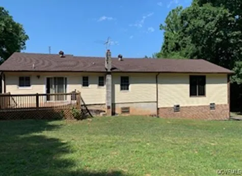 a front view of a house with a garden and yard