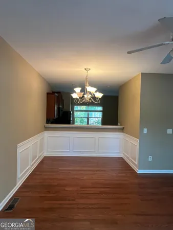 a view of a room with window and wooden floor