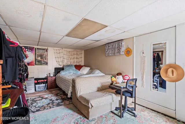 a bedroom with furniture and a window