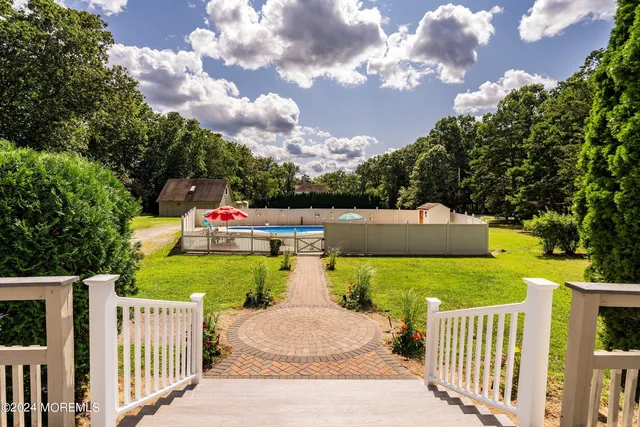 a childrens park with lots of trees in the background
