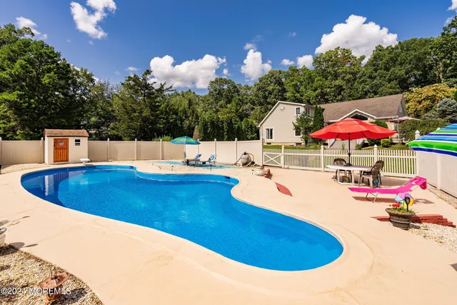 a view of a swimming pool with a patio