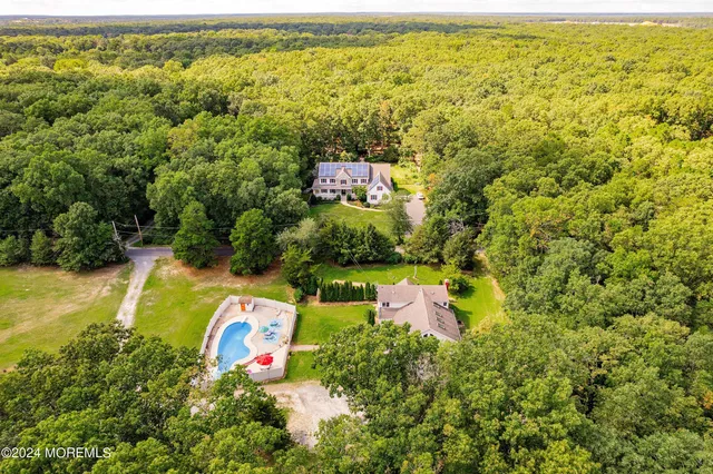 a view of a swimming pool with a yard