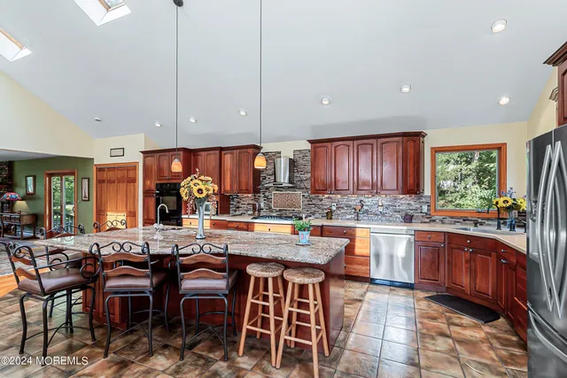 a kitchen with lots of counter top space and dining table