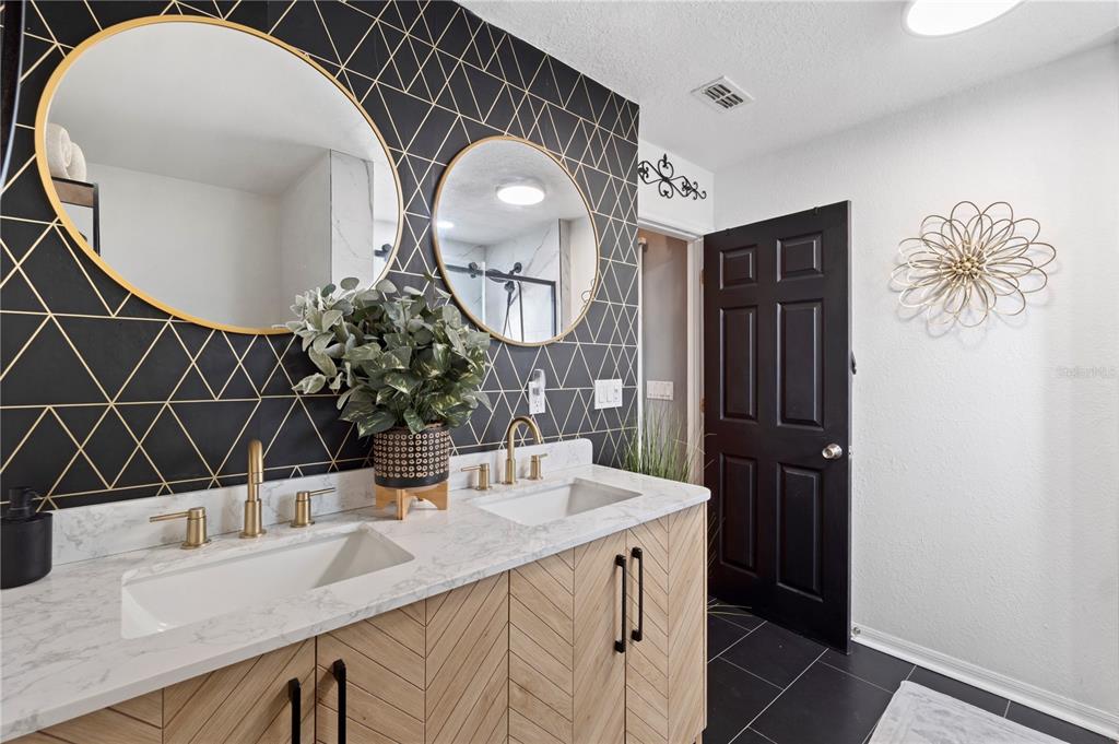 26650 Pelican Street Eustis, FL 32736 - Photo 35 of 69 a bathroom with a sink mirror and vanity
