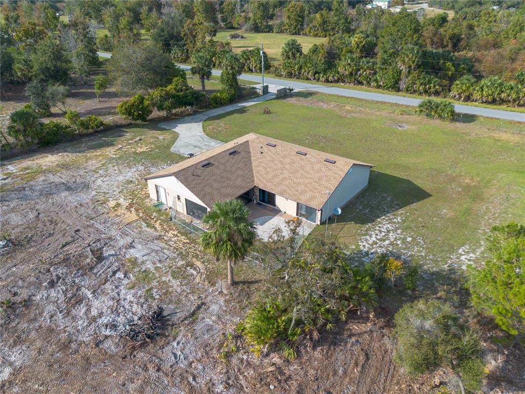 26650 Pelican Street Eustis, FL 32736 - Photo 65 of 69 an aerial view of a house having yard