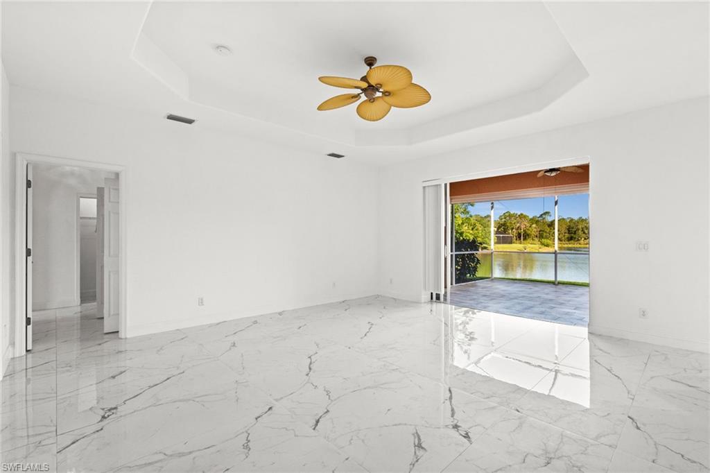 3972 Ruxton Road Naples, FL 34116 - Photo 13 of 41 a view of an empty room and window