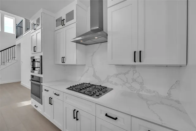 a kitchen with counter top space cabinets and appliances