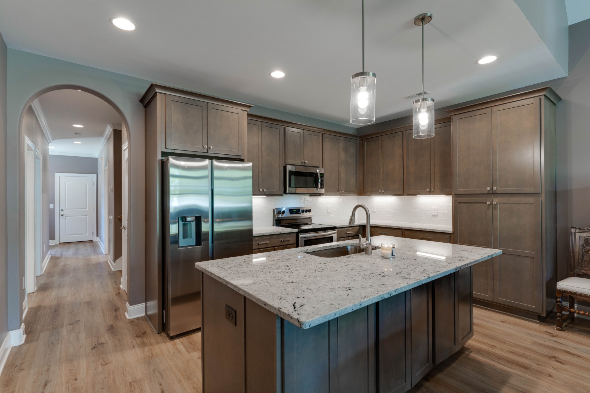 449 West Foxrun Springfield, TN 37172 - Photo 7 of 27 a kitchen with granite countertop a center island and stainless steel appliances