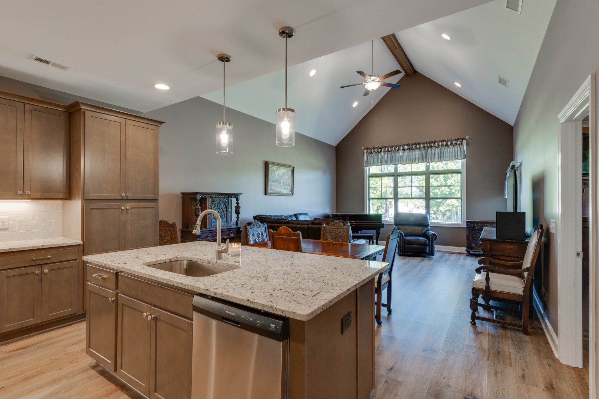 449 West Foxrun Springfield, TN 37172 - Photo 8 of 27 a kitchen with a stove a refrigerator a sink dishwasher with a dining table and chairs with wooden floor