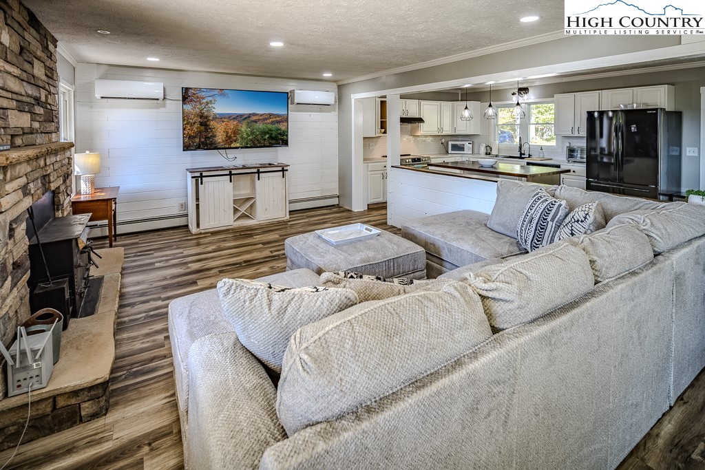 640 Fairview Heights Boone, NC 28607 - Photo 14 of 50 a living room with furniture and a flat screen tv