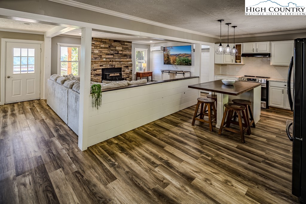 640 Fairview Heights Boone, NC 28607 - Photo 17 of 50 a open kitchen with stainless steel appliances granite countertop a stove and a refrigerator