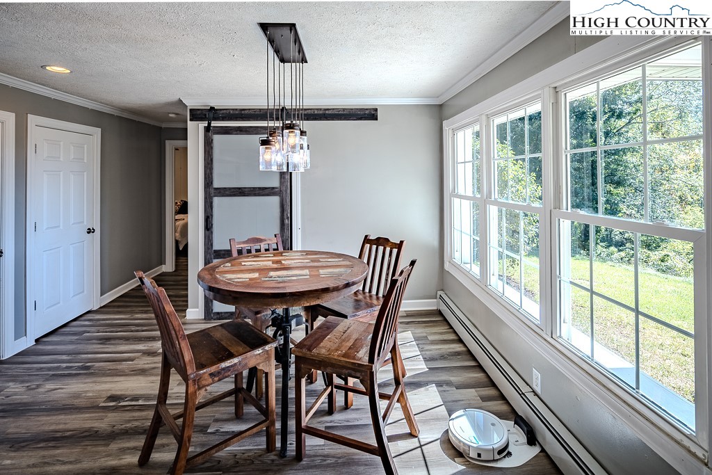 640 Fairview Heights Boone, NC 28607 - Photo 26 of 50 a view of a dining room with furniture window and wooden floor