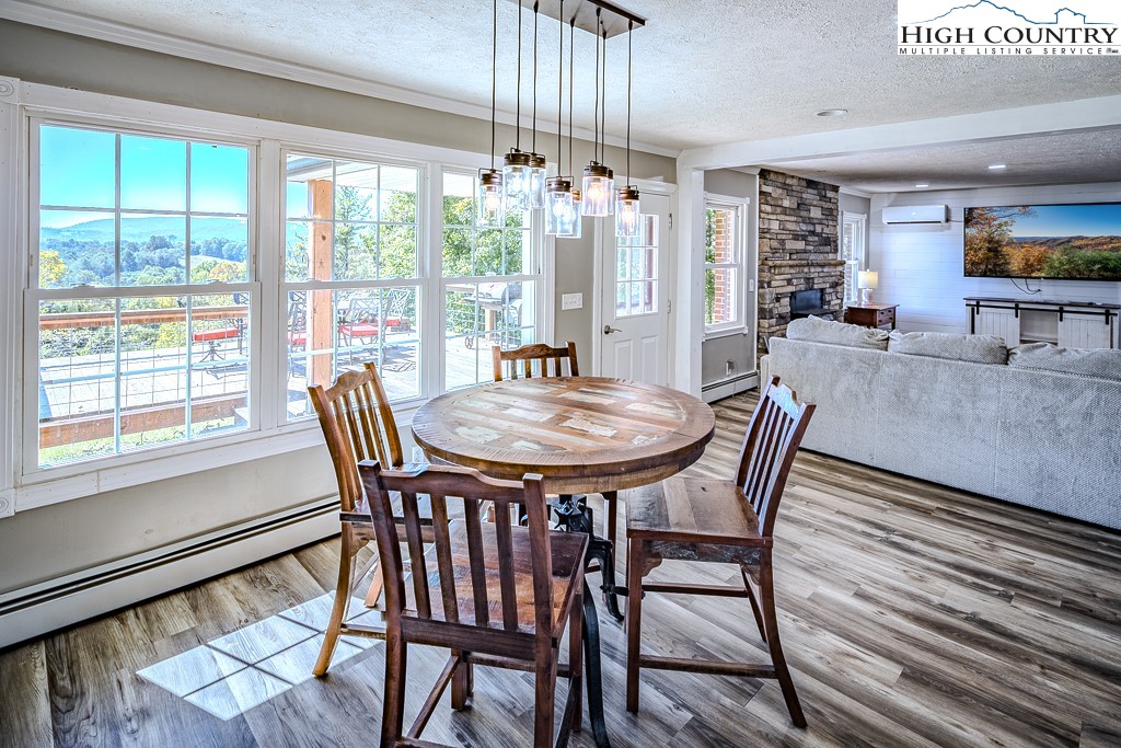 640 Fairview Heights Boone, NC 28607 - Photo 28 of 50 a view of a dining room with furniture window and wooden floor