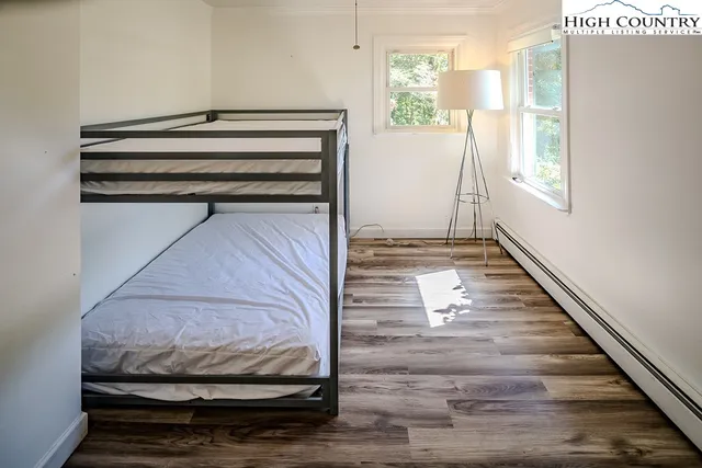 a bedroom with bed and window