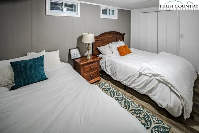 a bedroom with a bed and a fireplace