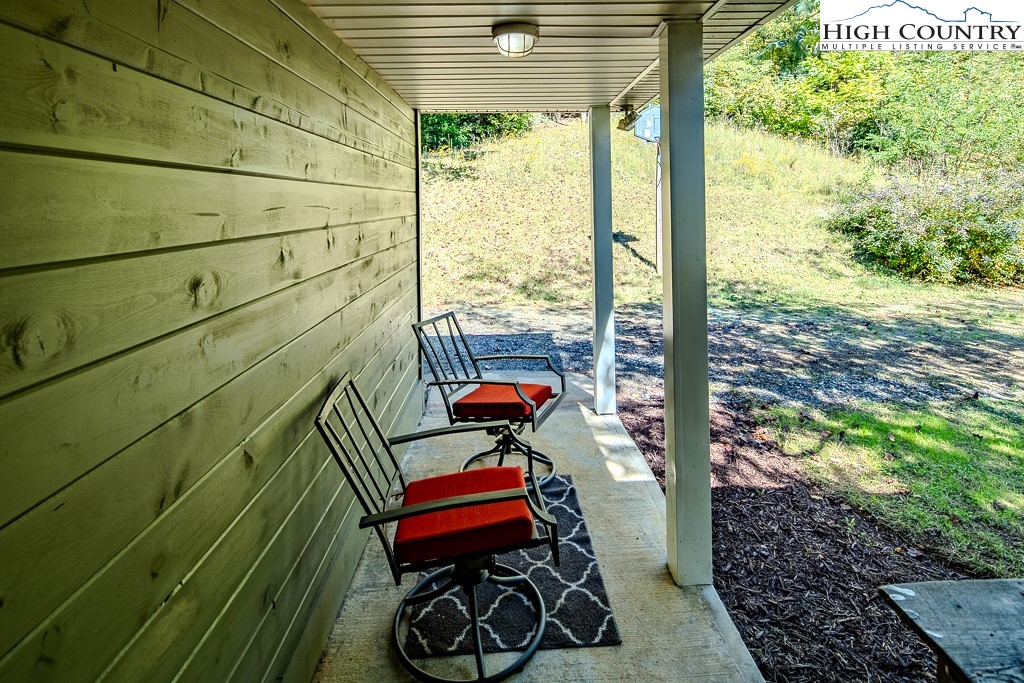 640 Fairview Heights Boone, NC 28607 - Photo 44 of 50 a balcony with chairs and a potted plant