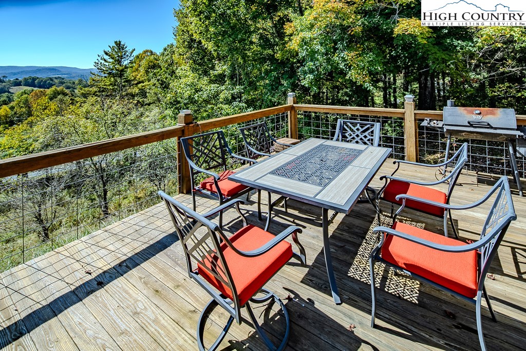 640 Fairview Heights Boone, NC 28607 - Photo 47 of 50 a roof deck with a table and chairs