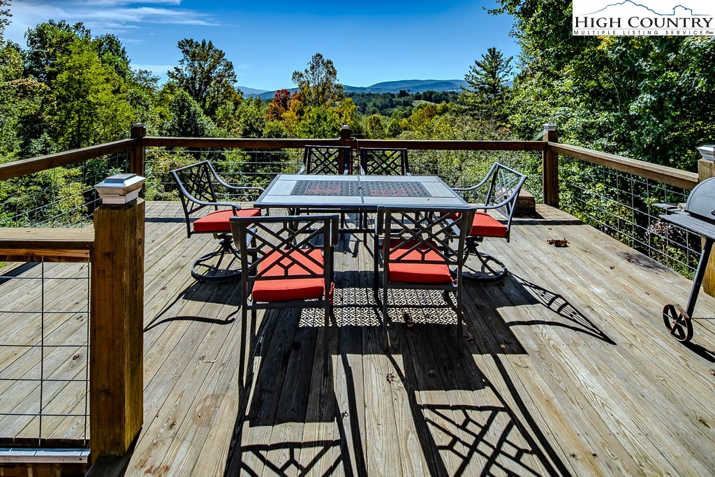 640 Fairview Heights Boone, NC 28607 - Photo 48 of 50 a view of balcony with wooden floor outdoor seating and city view