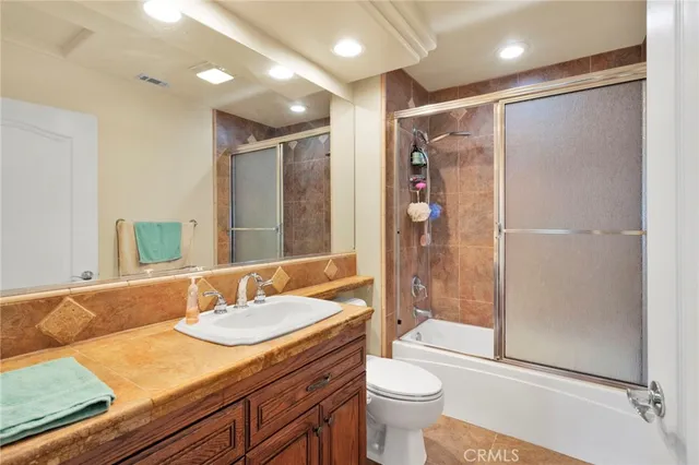 an aerial view of a house with a swimming pool