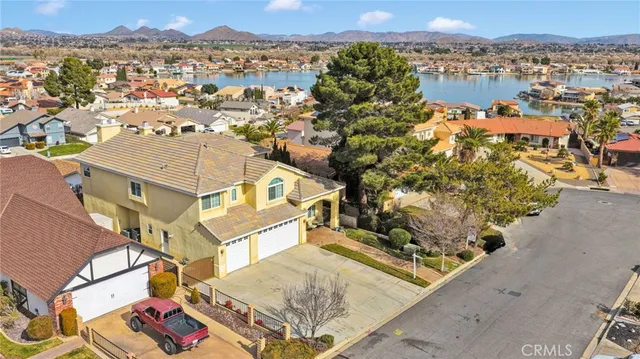 a living room with furniture a window and wooden floor