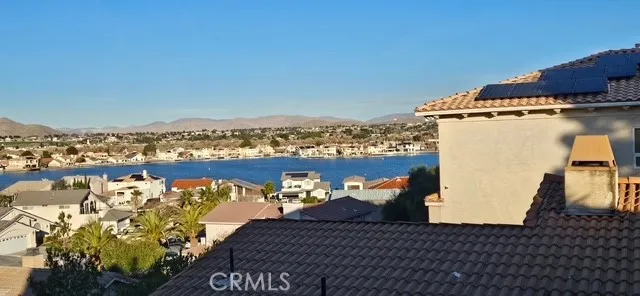 a view of a dining room with furniture and windows