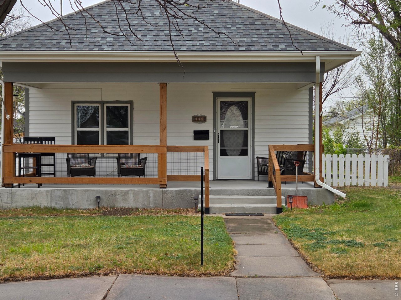a front view of house with small garden