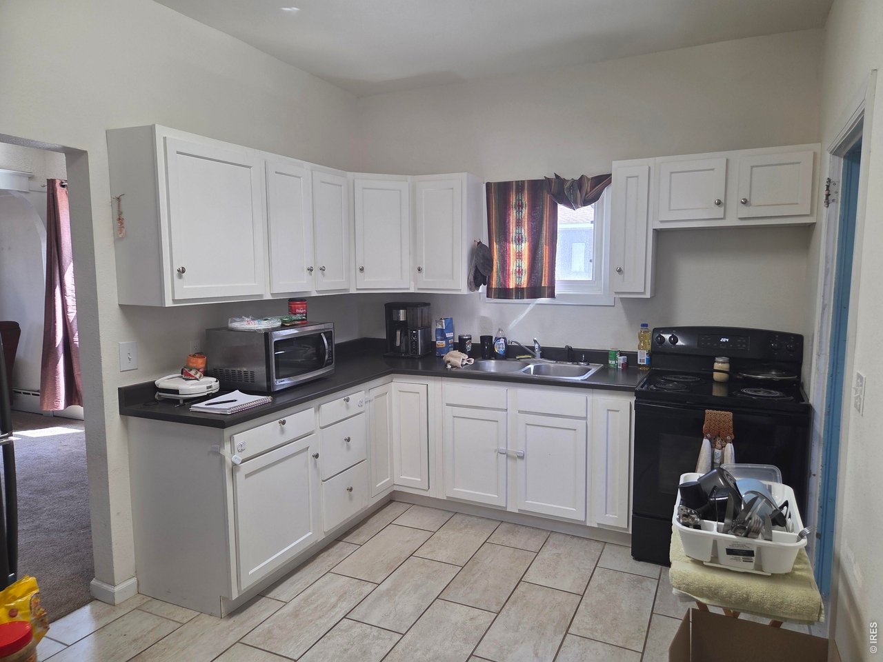 533 Main Avenue Akron, CO 80720 - Photo 2 of 11 a kitchen with stainless steel appliances granite countertop a stove and a sink