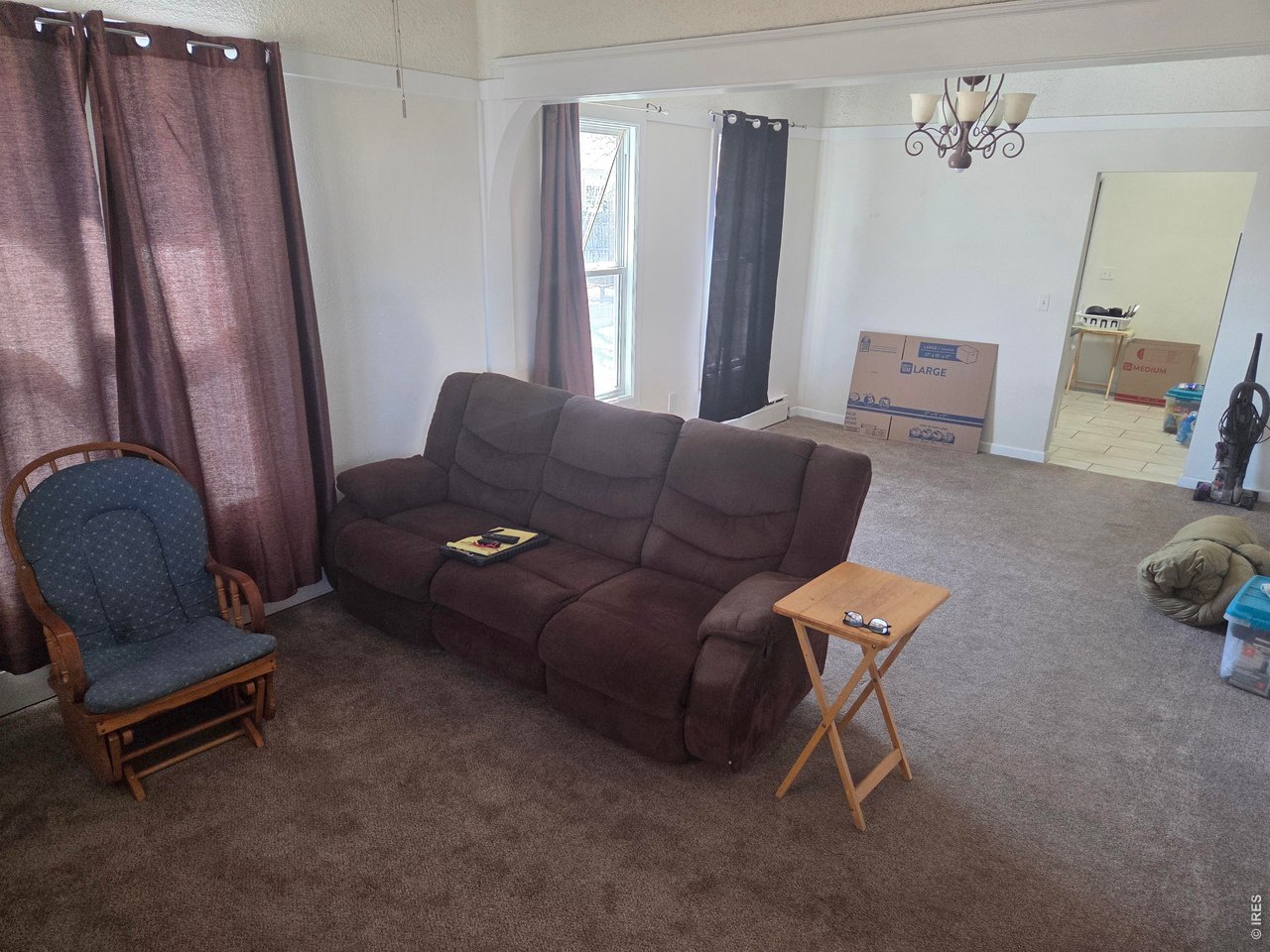 533 Main Avenue Akron, CO 80720 - Photo 3 of 11 a living room with furniture and a window
