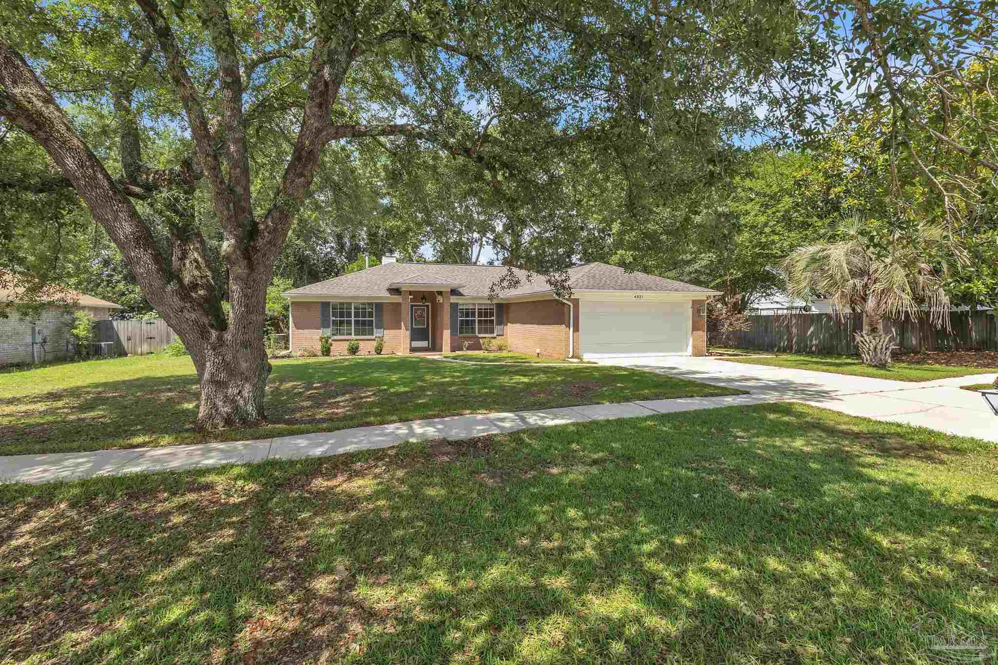 4321 Ridgeland Drive Pace, FL 32571 - Photo 31 of 36 a view of a house with a yard