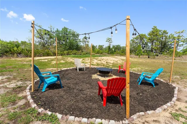 a view of a lake with a lounge chairs