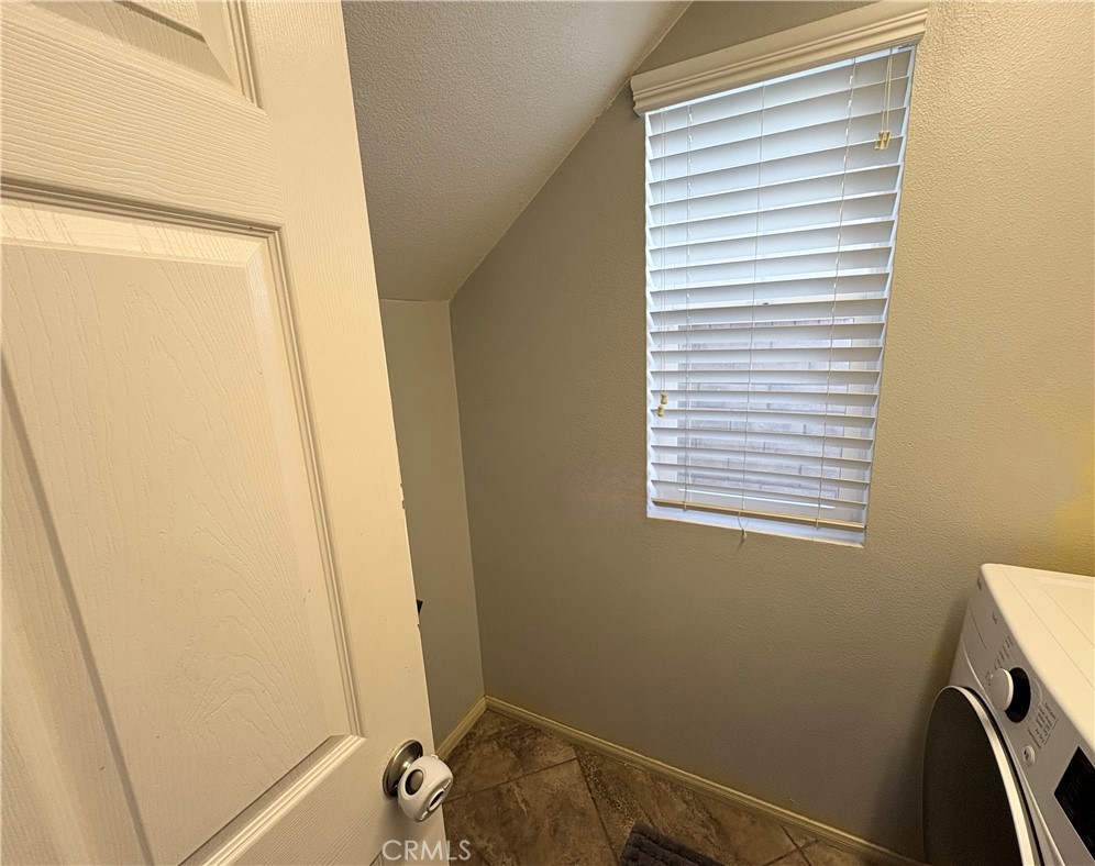 2729 Hornbeam Road Palmdale, CA 93551 - Photo 18 of 35 a bathroom with a sink and a window