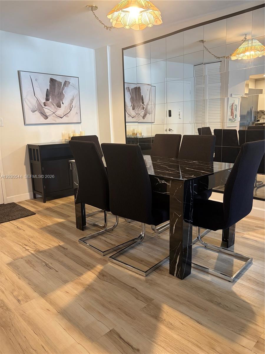 1913 South Ocean Drive, Unit 427 Hallandale Beach, FL 33009 - Photo 6 of 16 a view of a dining room with furniture