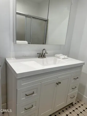a bathroom with a sink and a mirror