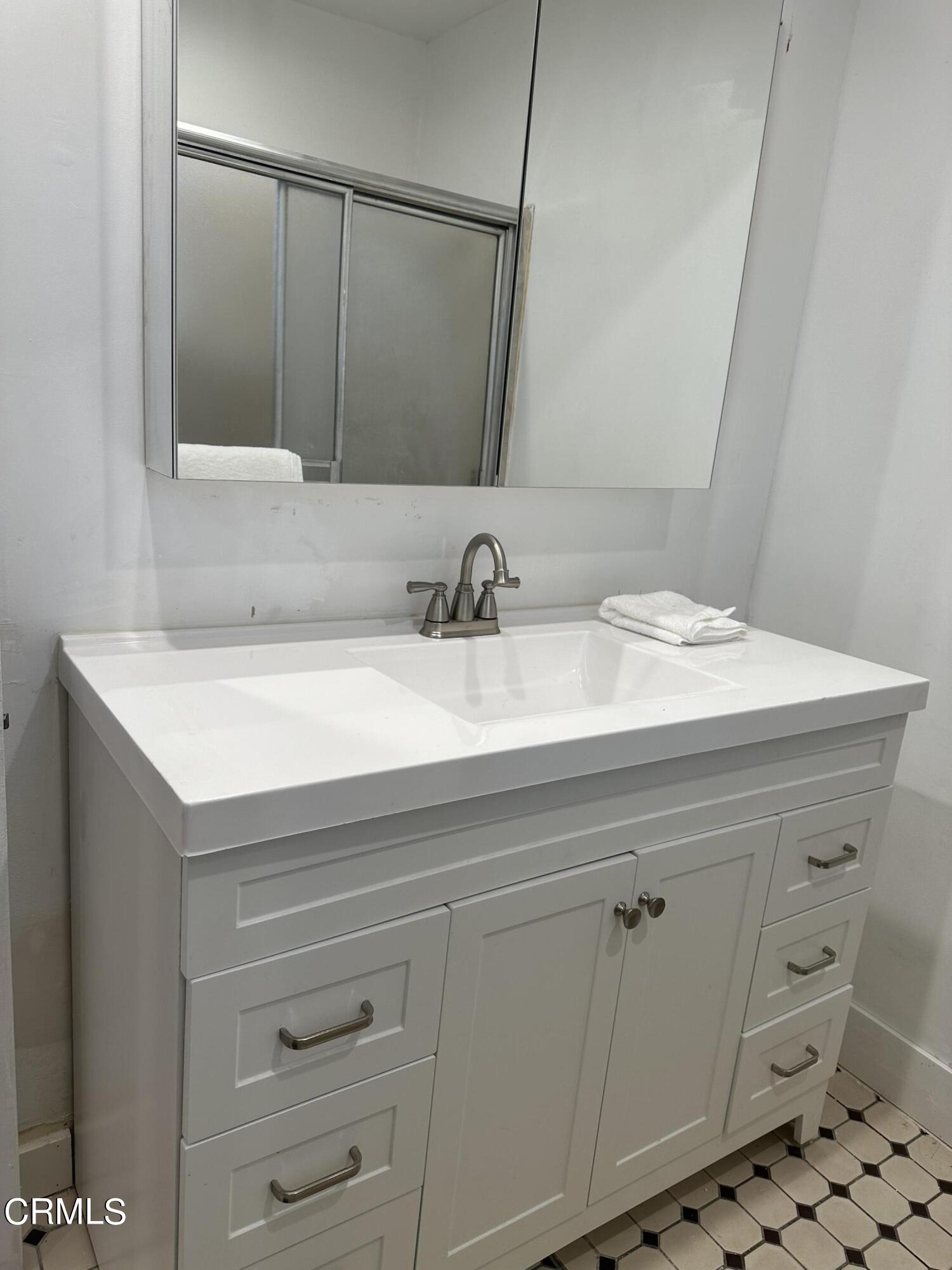 117 North Alta Vista Avenue Monrovia, CA 91016 - Photo 13 of 23 a bathroom with a sink and a mirror