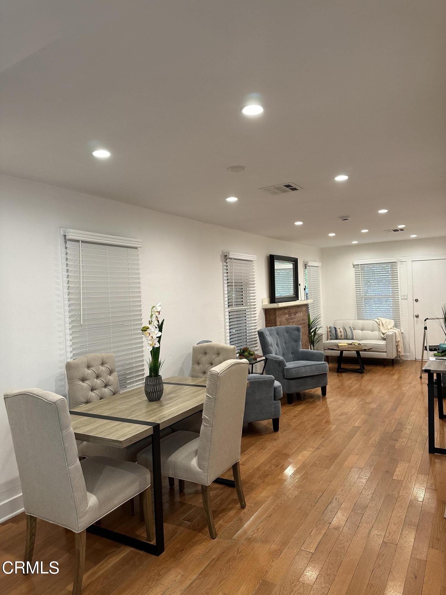 117 North Alta Vista Avenue Monrovia, CA 91016 - Photo 2 of 23 a living room with furniture and a wooden floor
