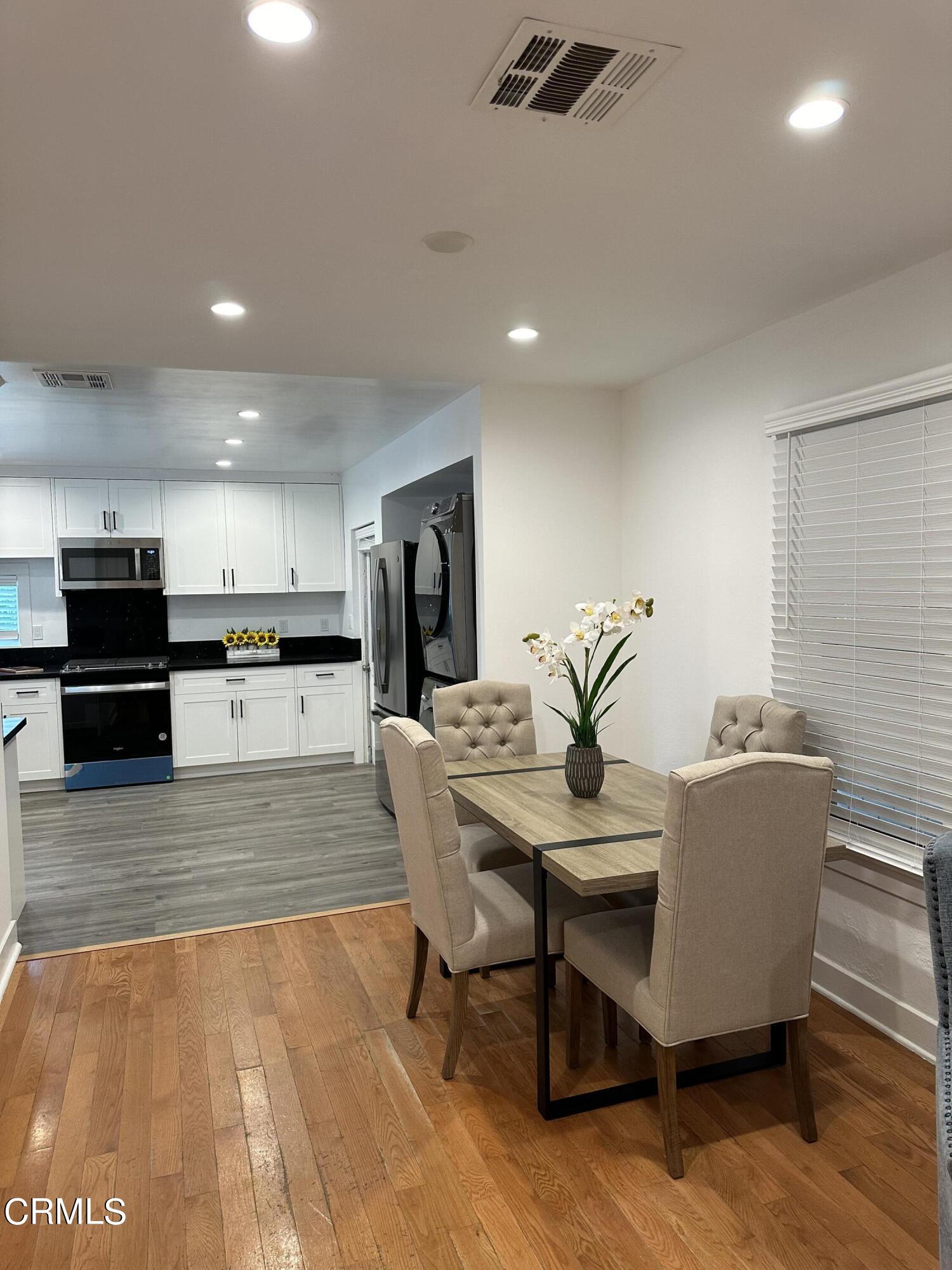 117 North Alta Vista Avenue Monrovia, CA 91016 - Photo 5 of 23 a dining room with furniture and wooden floor