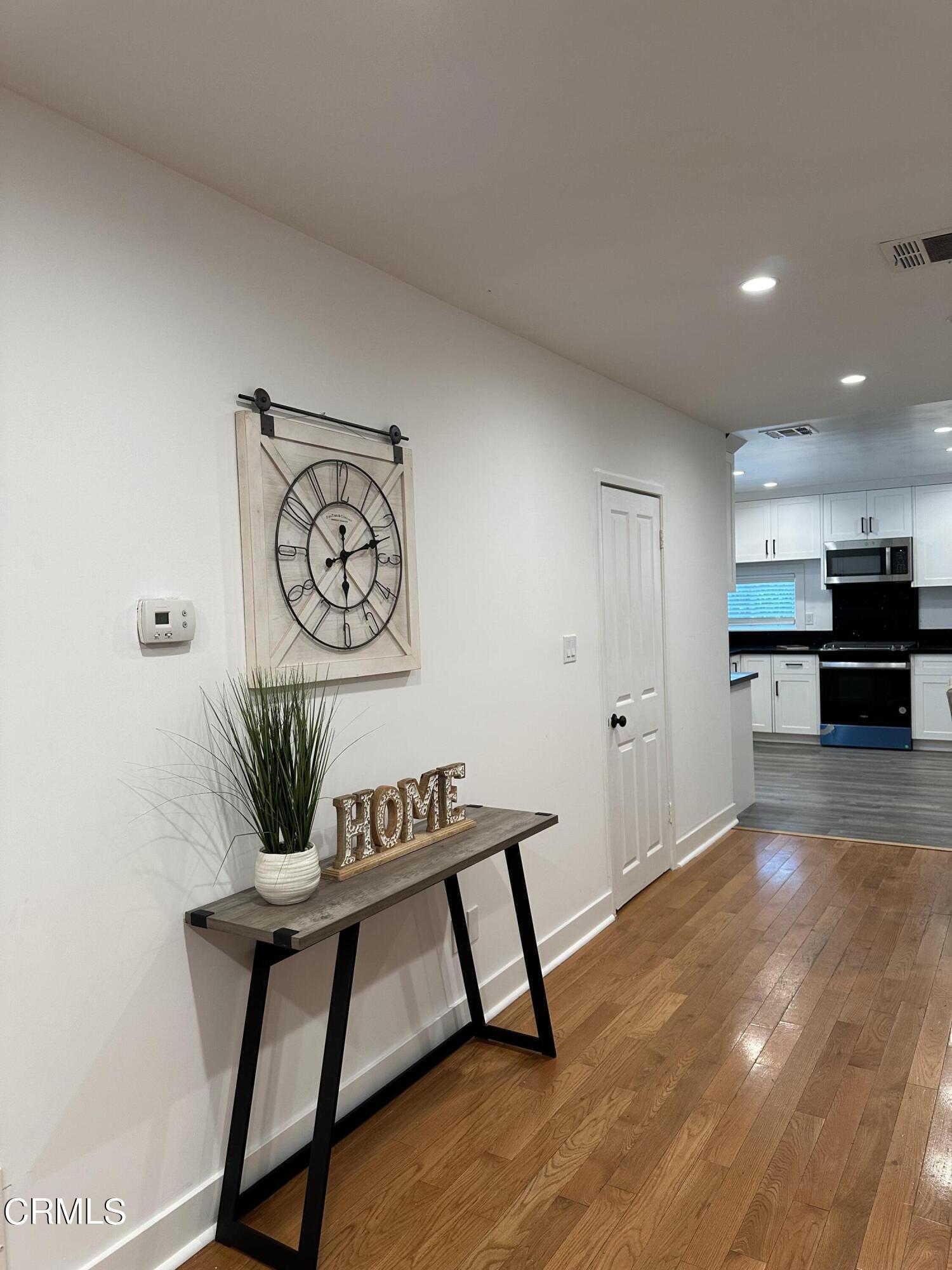 117 North Alta Vista Avenue Monrovia, CA 91016 - Photo 9 of 23 a living room with furniture and a wooden floor