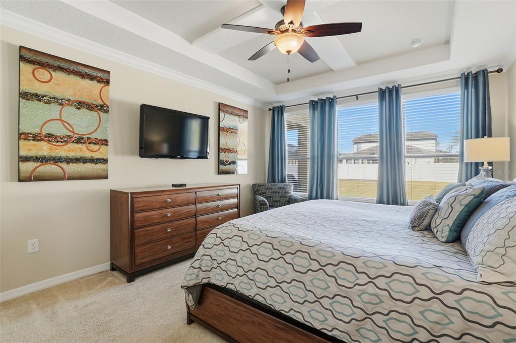 1154 Fountain Coin Loop Orlando, FL 32828 - Photo 19 of 48 a bedroom with a bed and a flat screen tv